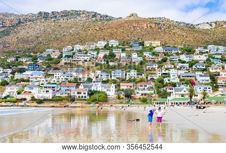 People Walking On Blue Flag Fish Hoek Beach At Low Tide