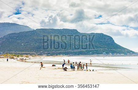 Kids Building Sand Castles On The Beach During School Holidays