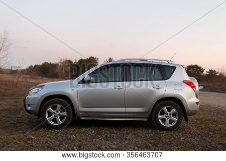 Dnipro, Ukraine - February 19, 2020: Toyota Rav4 2006 Gray Color Near The Forest, Open Space In Twil