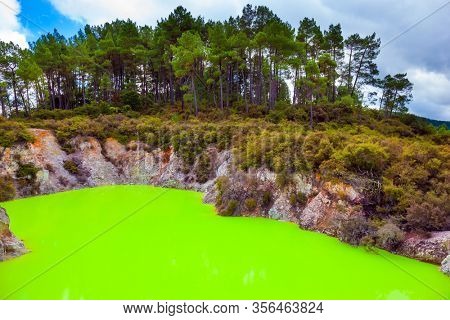 New Zealand, North Island. Devil's Bath with bright green water. Volcanic Valley Waimangu, Wai-O-Tapu. The unique geothermal area of Rotorua. Extreme, exotic and photo tourism concept