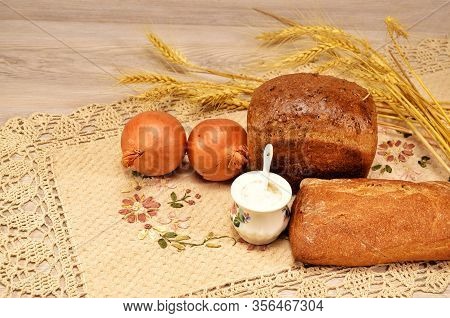 Rosy And Delicious Bread With Onions And Salt On A Linen Napkin
