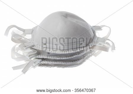 Stack Pile Of Face Masks For Respiratory Protection Agains Virus And Dust. Isolated On White.