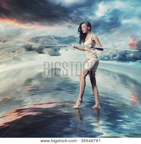 Joven belleza morena como un equilibrista