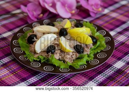 Ready Cold Dish: San Isidoro Salad With Tuna, Eggs And Vegetables On A Brown Plate - Spanish Cuisine
