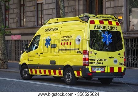 Barcelona, Spain - May 16, 2017: View Of The Yellow Ambulance Car In Center Of Barcelona.
