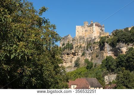 The Medieval Chateau De Beynac Rising On A Limestone Cliff Above The Dordogne River. France, Dordogn