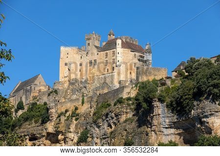The Medieval Chateau De Beynac Rising On A Limestone Cliff Above The Dordogne River. France, Dordogn