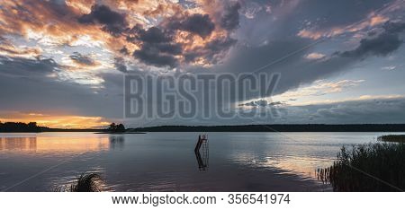 Grass And Lake During Sunset