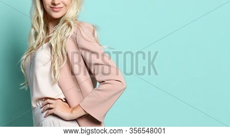 Cropped Photo Of Woman In Beige Jacket And White Overall. There Is Watch On Her Hand. Smiling, Touch