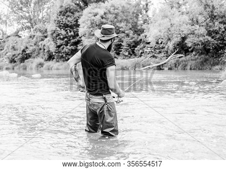 Catch A Trophy Fishing. Fisherman With Fishing Rod. Summer Weekend. Big Game Fishing. Mature Man Fly