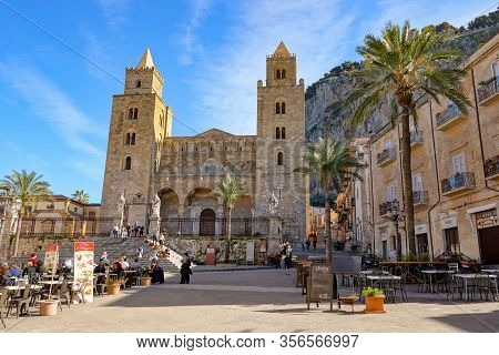 Cefalu, Sicily - February 11, 2020: The Cefalu Cathedral (chiesa Di Cefalu) In Nice Sunny Day With T