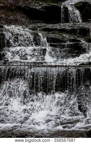Little Waterfall Down The Canyon In The Middle Of The Green Forest