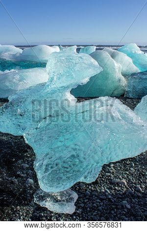 Ice Fields At The Black Pebble Beach, Coast Of Iceland