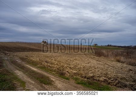 Panorama Of Arable Land Under Amazing Clouds
