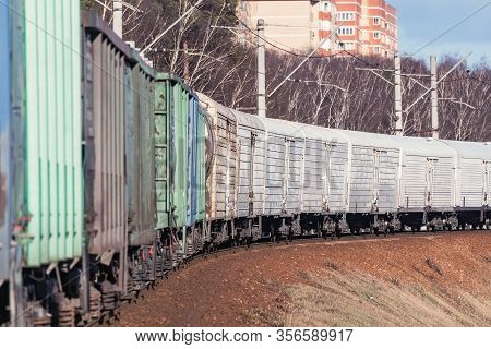 Thermos Carriages In The Freight Train Moving By The Spring Forest.