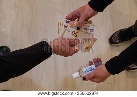 Hand Sanitizer Buying Shortage Concept Selling Antiseptic Gel. Woman Hands Over A Waterless Alcohol-