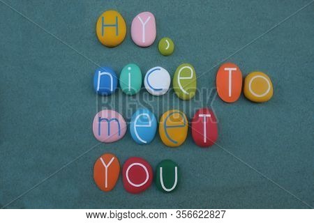 Hy, Nice To Meet You, Creative Text Composed With Multi Colored Stone Letters Over Green Sand