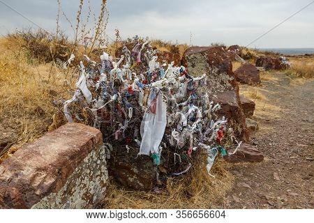 Akyrtas Palace Complex, Rags On The Branches Of A Bush Near A Large Stone.