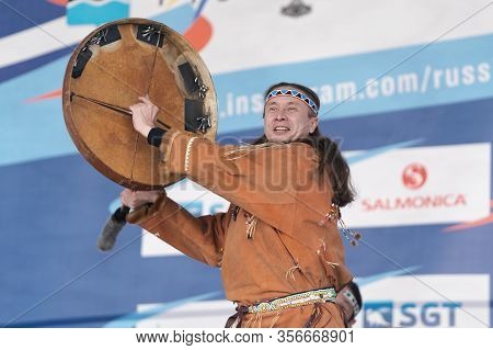 Male Dancer In National Clothes Indigenous People Emotional Dancing With Tambourine. Concert Koryak 