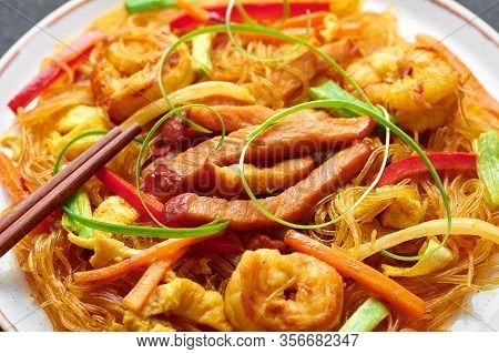 Singapore Mei Fun. Singapore Noodles Is Chinese Cuisine Dish With Rice Noodles, Prawns, Char Siu Por