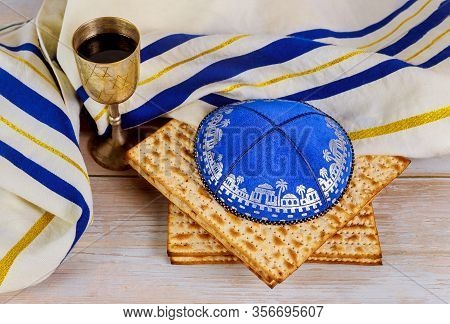 Pessach Matzo With Kiddush Cup Of Wine In The Kippa