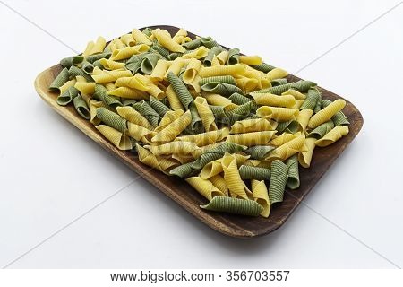 Italian Raw Colored Pasta. Maccheroni Al Pettine.