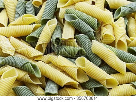 Italian Raw Colored Pasta. Maccheroni Al Pettine.