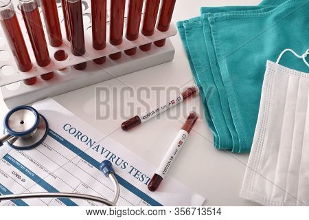 Tubes With Coronavirus Infected Blood Samples On Laboratory Bench. Top View.