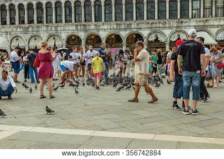 St. Mark Square, Venice, Italy - August 02, 2019: Warm Sunny Summer Day. Numerous Tourists Are Photo