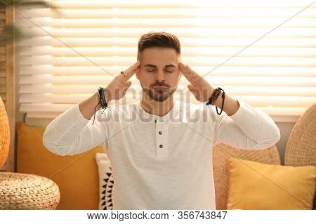 Young Man During Self-healing Session In Therapy Room