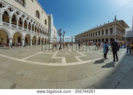 St. Mark Square, Venice, Italy - August 02, 2019: Torre Dell Orologio, Basilica And Museum San Marco