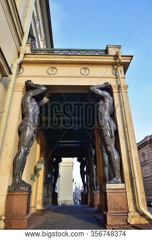 Saint Petersburg, Russia - January 32, 2020: Atlas (atlant) Granite Sculptures Of A Man Supporting C