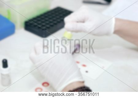 Scientist Working In His Laboratory. A Blood Test Is A Laboratory Analysis Performed On A Blood Samp