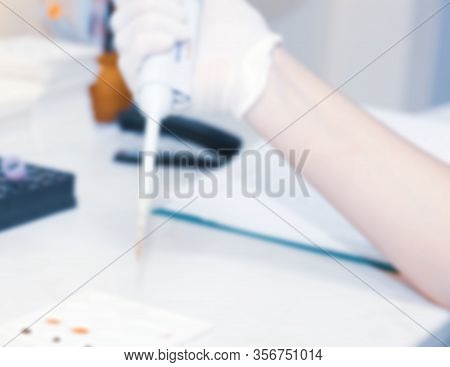Scientist Working In His Laboratory. A Blood Test Is A Laboratory Analysis Performed On A Blood Samp