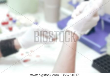 Scientist Working In His Laboratory. A Blood Test Is A Laboratory Analysis Performed On A Blood Samp