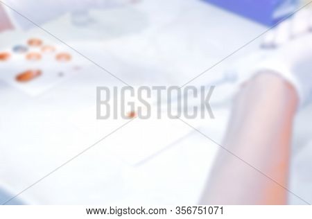Scientist Working In His Laboratory. A Blood Test Is A Laboratory Analysis Performed On A Blood Samp