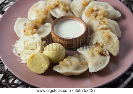 Dumplings With Stewed Cabbage, Homemade Traditional Ukrainian Dish Varenyky