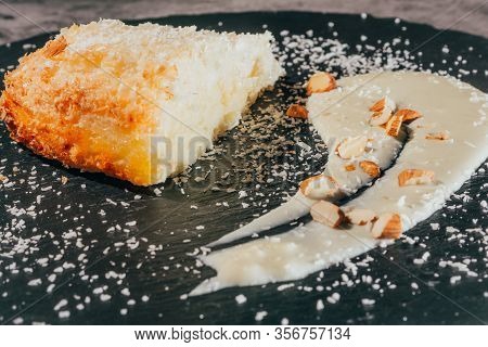 Cake With Almonds And Coconut Shvings On Top