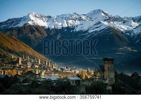 View Of The Svanetian Towers With Night Illumination In Mestia Village At Sunrise. Upper Svaneti, Ge