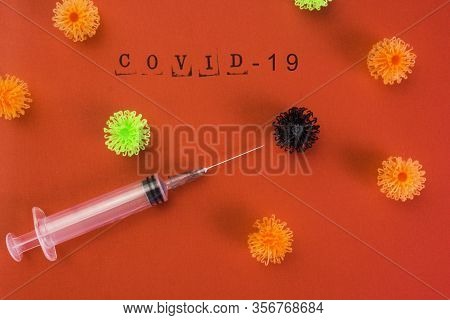 Syringe Vaccine Of Virus Convid 19 In Red Background