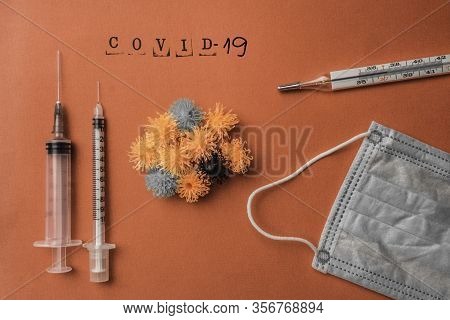 Syringe Vaccine Of Virus Convid 19 In Background, Mask