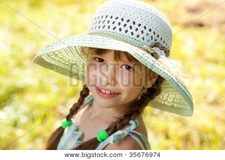 Dark-haired Girl In A Hat And Dress