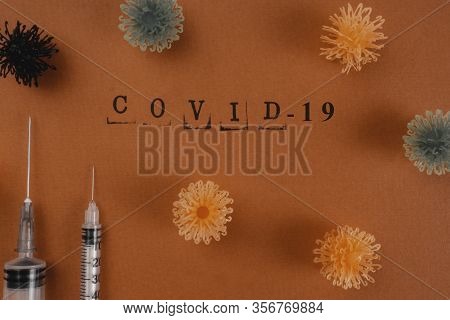 Syringe Vaccine Of Virus Convid 19 In Background, Mask