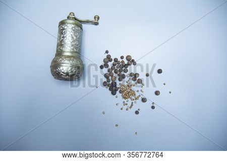 Iron Bowl For Grinding Pepper And Pepper In Cereal.