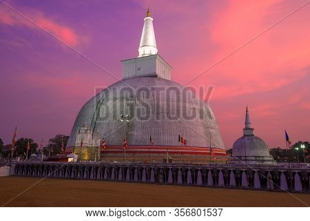 Ruwanweli Maha Seya Dagoba  Close-up On A Sunset Background. Anuradhapura, Sri Lanka