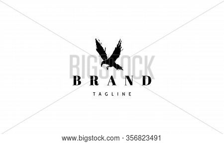 Vector Logo On Which An Abstract Image Of A Flying Gloomy Crow.