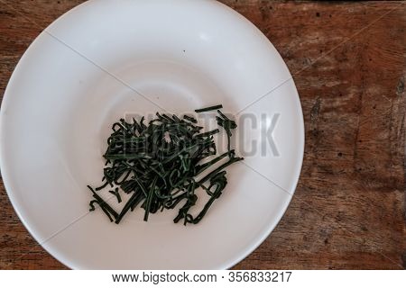Spiruline Marine Flakes On Plate. Dietary Supplement, Super Food.