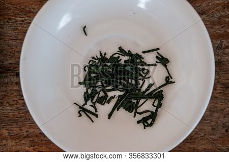 Spiruline Marine Flakes On Plate. Dietary Supplement, Super Food.