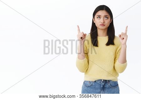 Disappointed Cute Gloomy Girl Looking Upwards Skeptical And Sulky. Beautiful Asian Stylish Woman In 