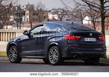 Krakow, Poland 23.02.2020: Black Bmw X4 Expensive German Car On A City Street . Parking On The Road.